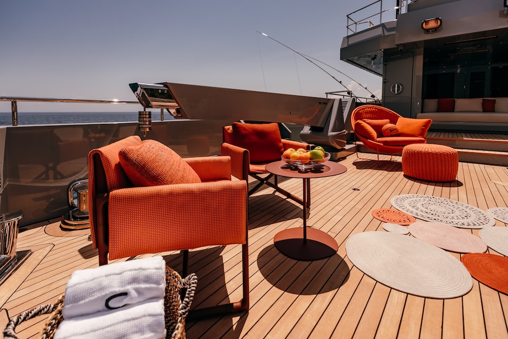 Guests relaxing on deck aboard CARMEN yacht enjoying calm sea views