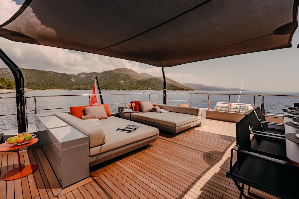Sky lounge on upper deck of CARMEN yacht offering shaded seating and panoramic views