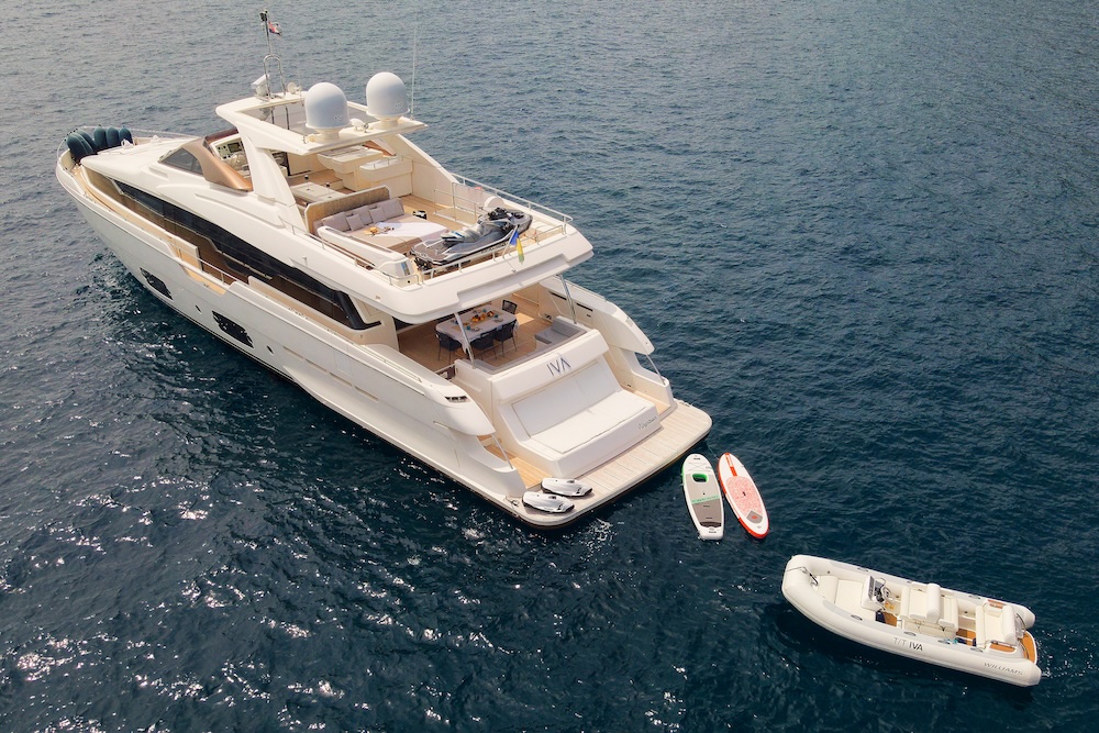 IVA yacht swim platform with paddleboards and water toys