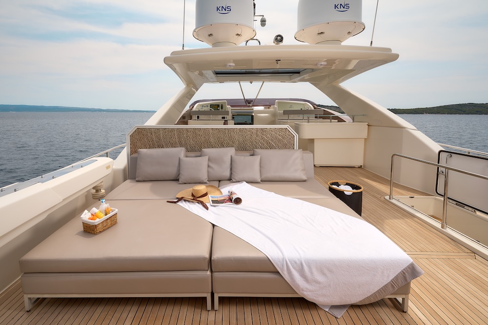 Flybridge lounge area on IVA yacht with open sea views