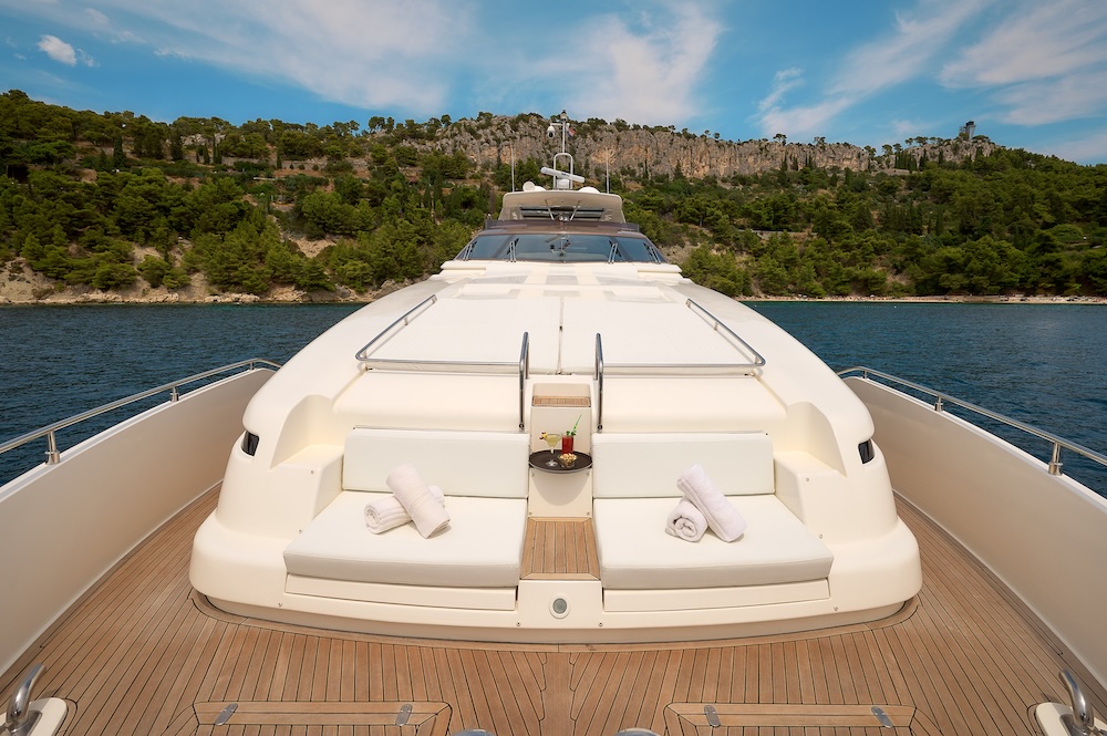 Foredeck lounge area on IVA yacht with sunpads and sea views