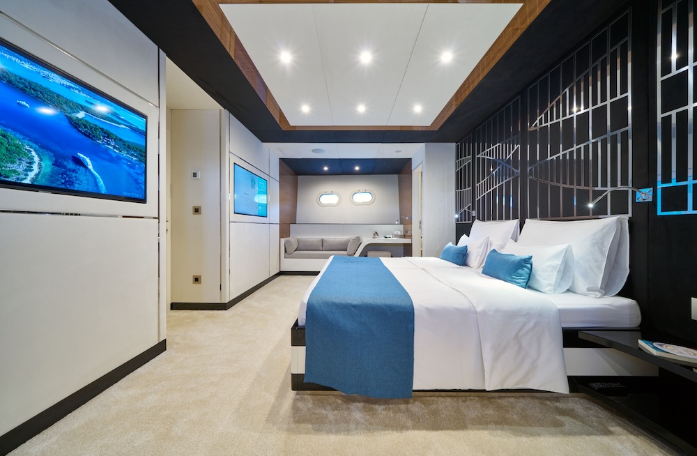 Acapella yacht guest cabin with contemporary design and soft blue accents