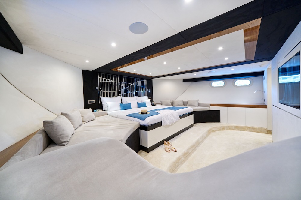 Acapella yacht master suite with lounge seating and spacious contemporary interior
