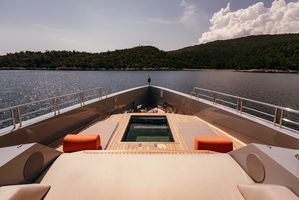 Private jacuzzi on deck of CARMEN yacht with surrounding seating and sea views