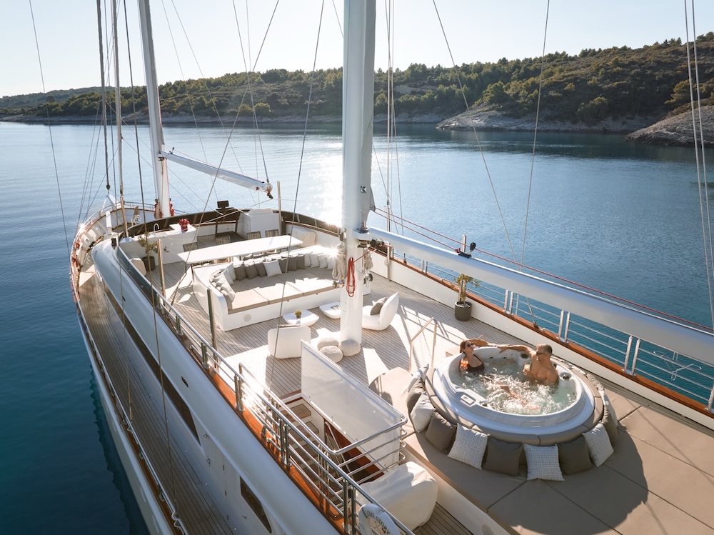 Sundeck jacuzzi on Love Story yacht with open sea views and relaxed seating