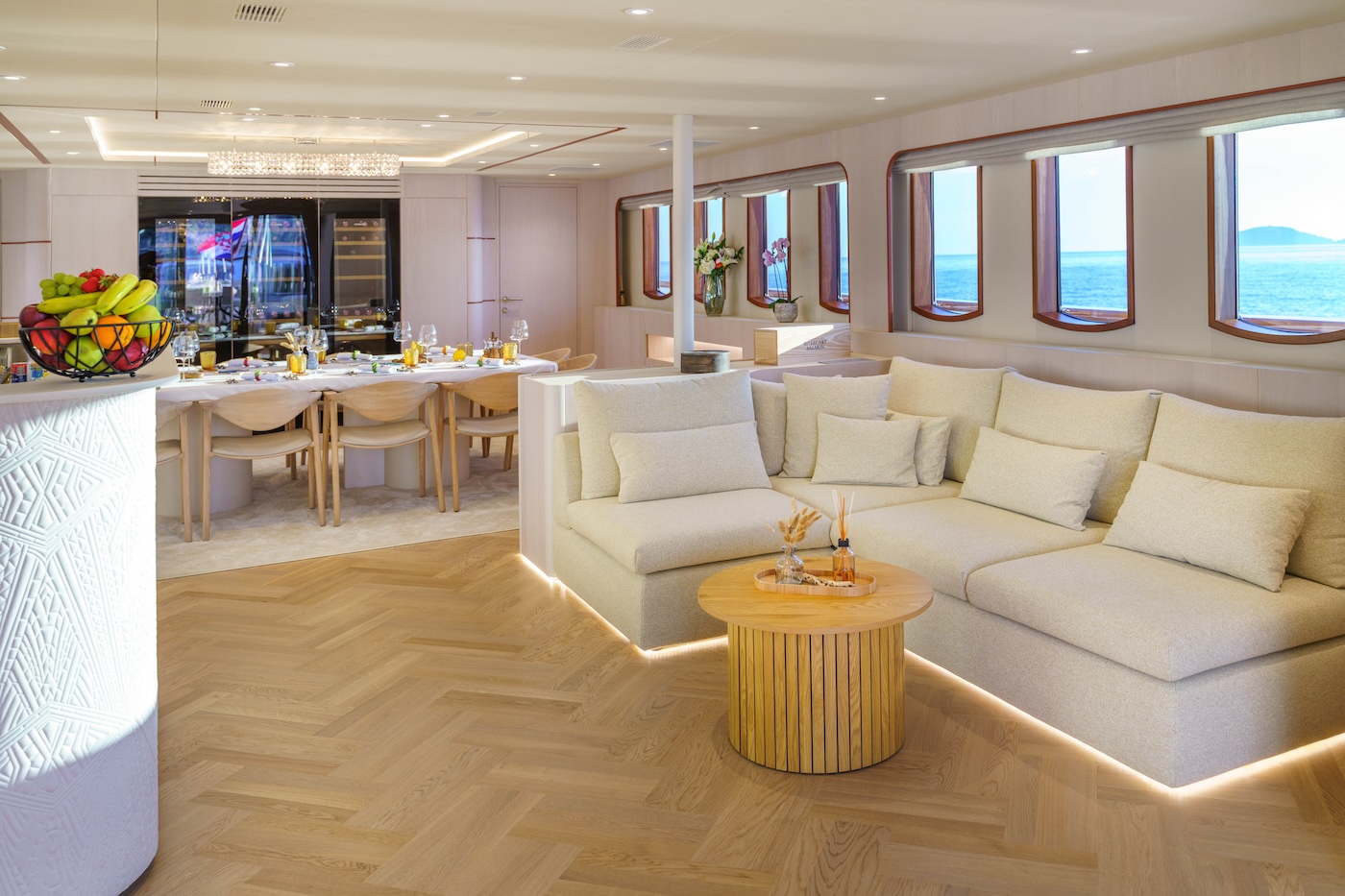 MAIA yacht main salon dining area with large table and ocean views