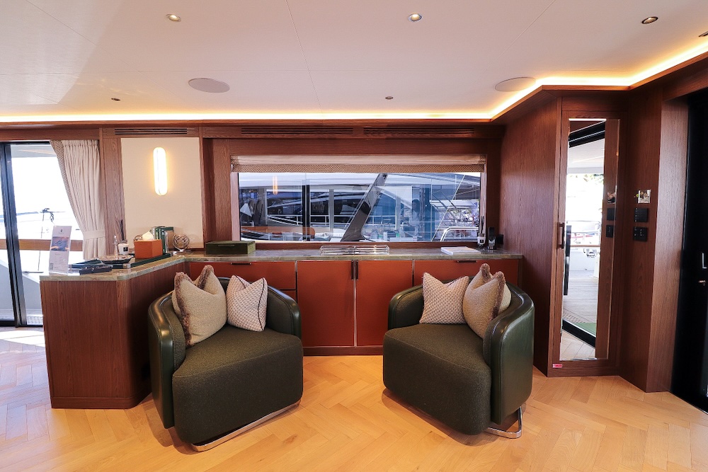 Main saloon on Majera yacht with warm lighting, refined finishes, and comfortable seating