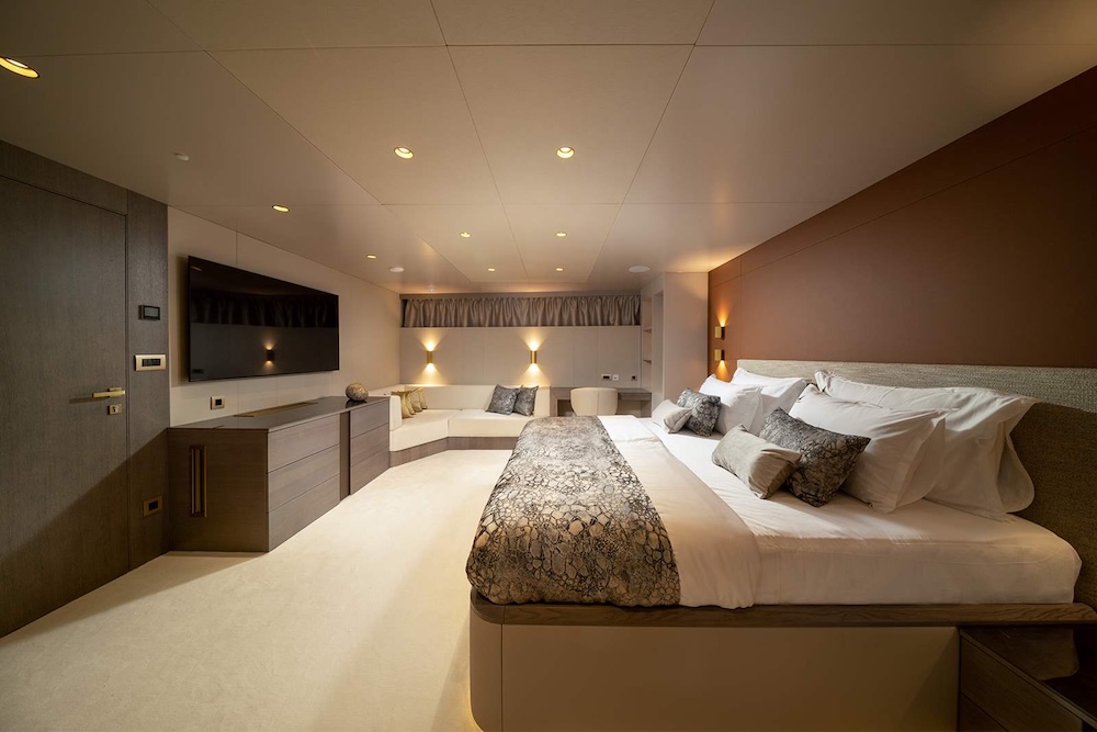 Guest cabin aboard S/Y Nocturno with clean design and warm lighting