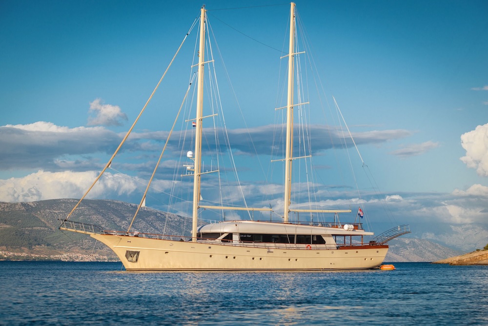 Son de Mar motor sailer anchored in clear Adriatic waters