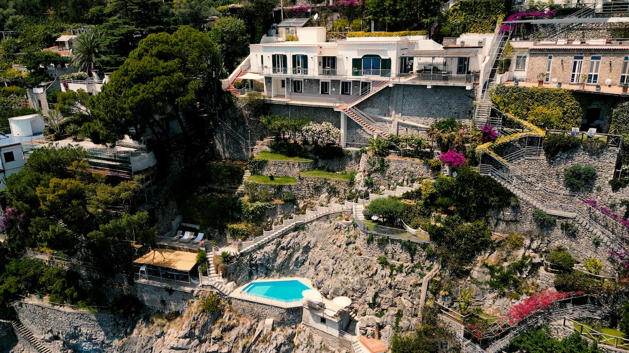 Exterior view of Villa Eris on the Amalfi Coast surrounded by Mediterranean landscape
