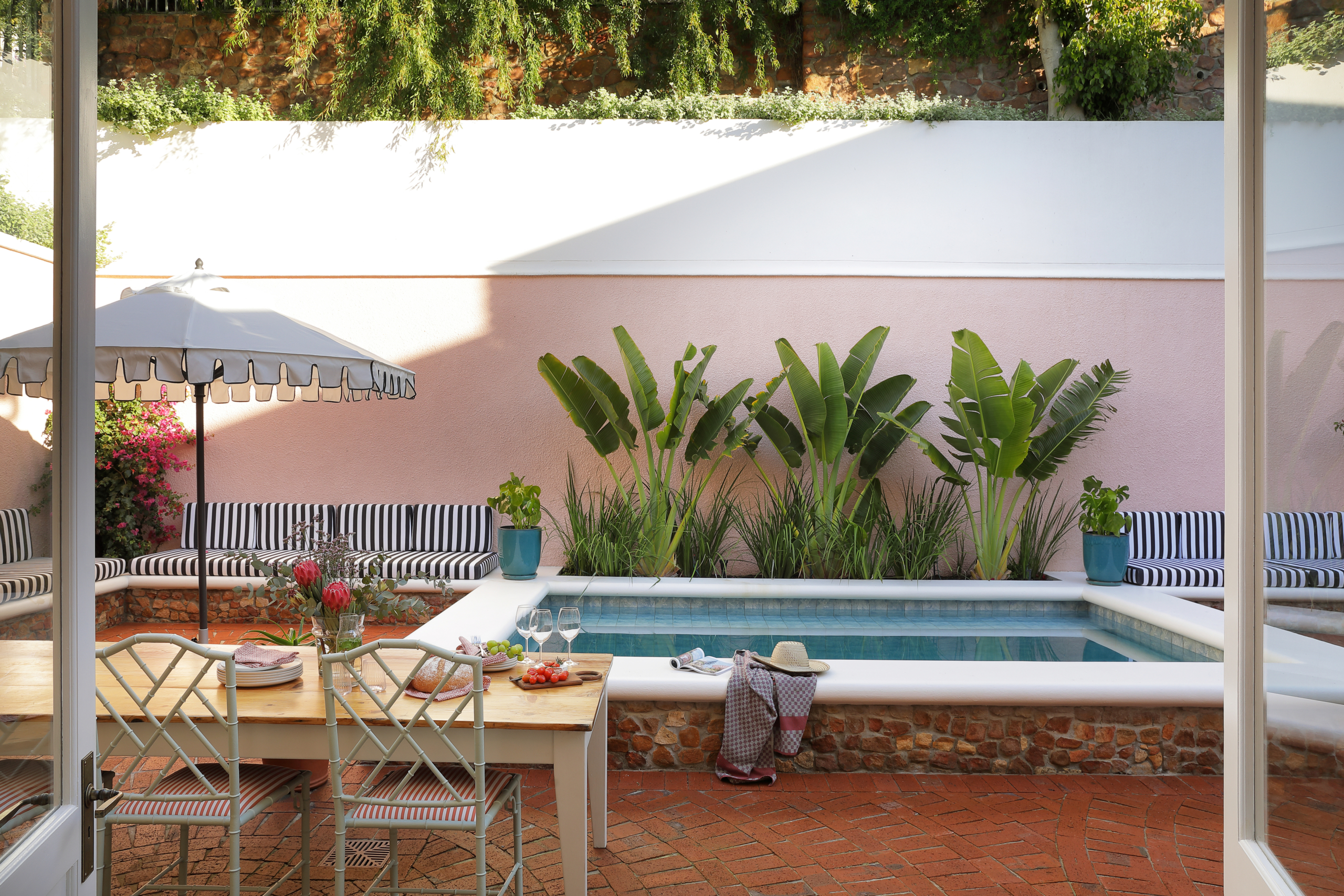 Pool terrace dining area at Villa Issima Hillside House in Cape Town