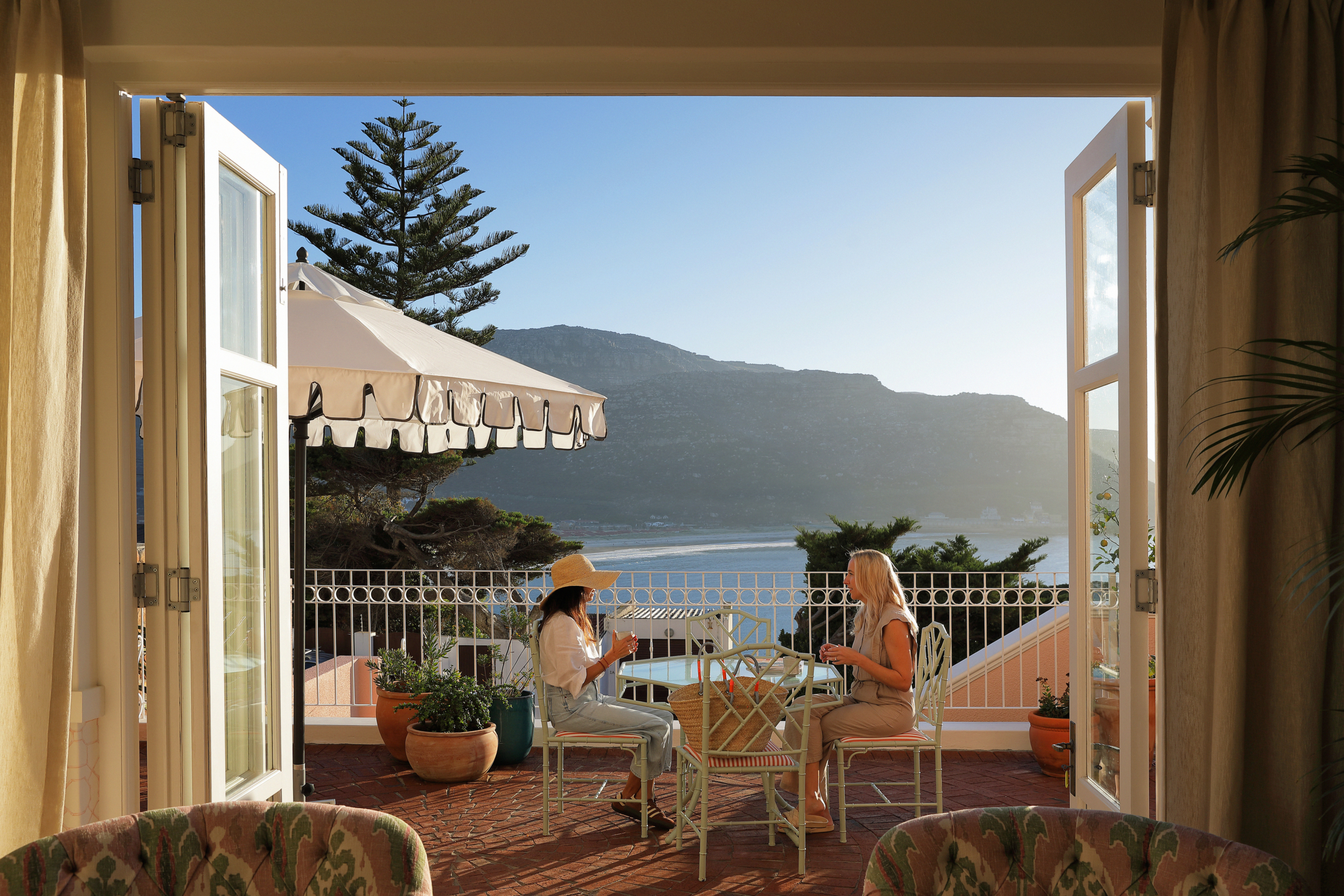 Guests enjoying drinks on the terrace at Villa Issima Hillside House in Cape Town