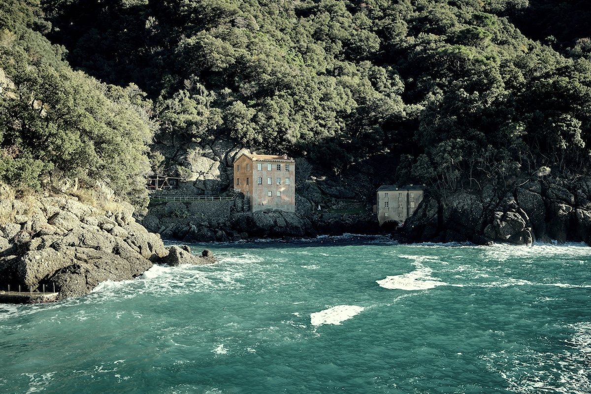 Hidden bay on the Amalfi Coast with traditional coastal houses and turquoise water