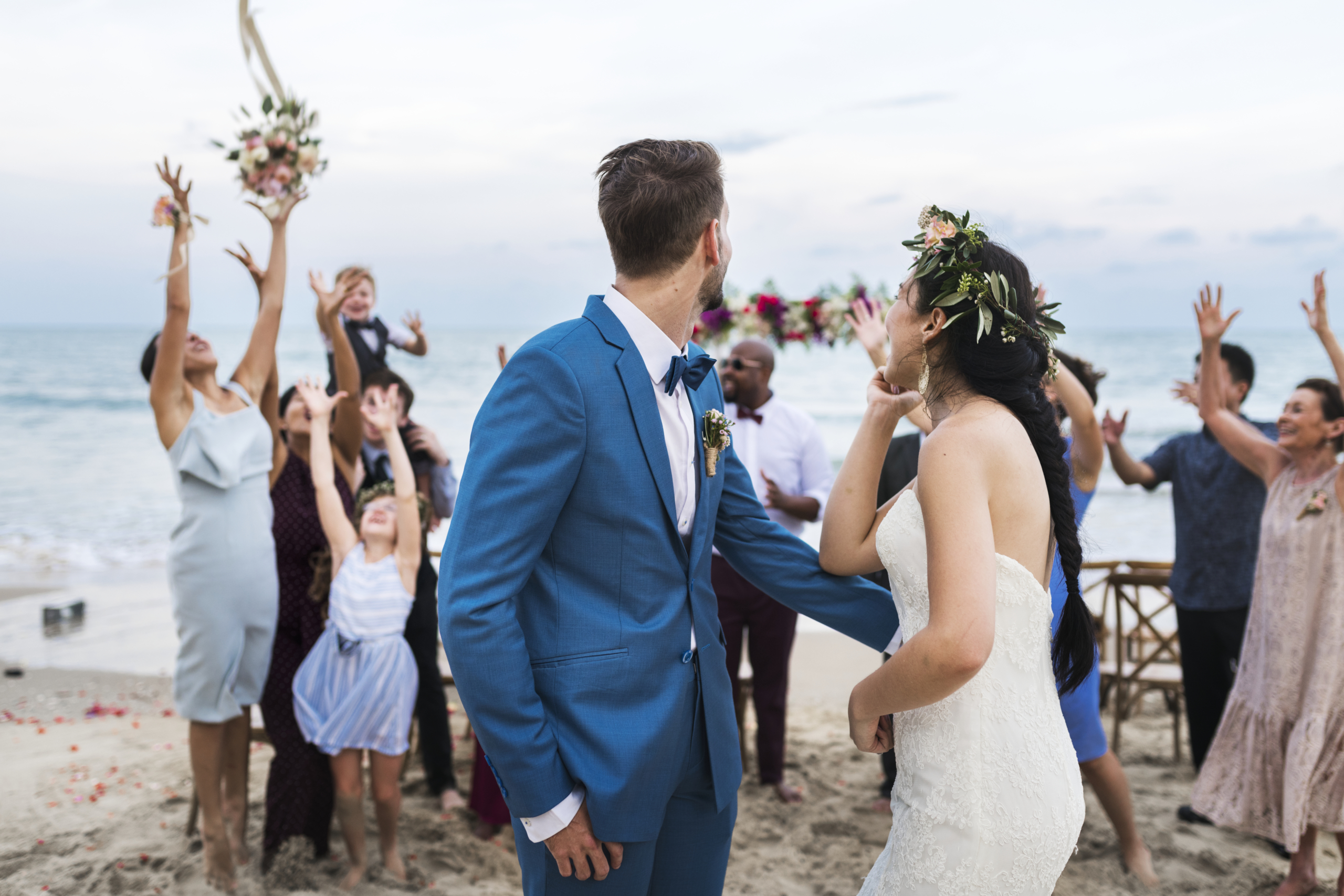 Family and friends celebrating together during a beachside wedding and private gathering