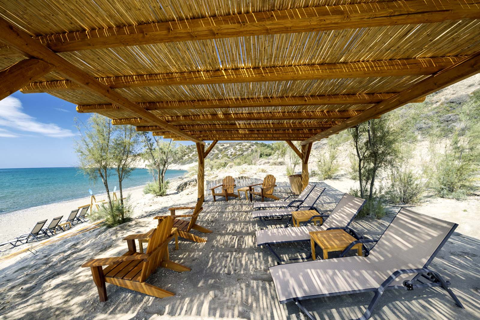 Covered terrace beside the infinity pool at Beach House Arvi East