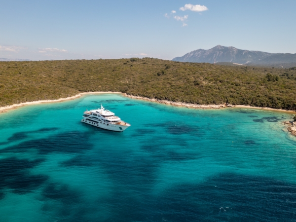 Private yacht anchored in a hidden cove along Croatia’s Dalmatian Coast