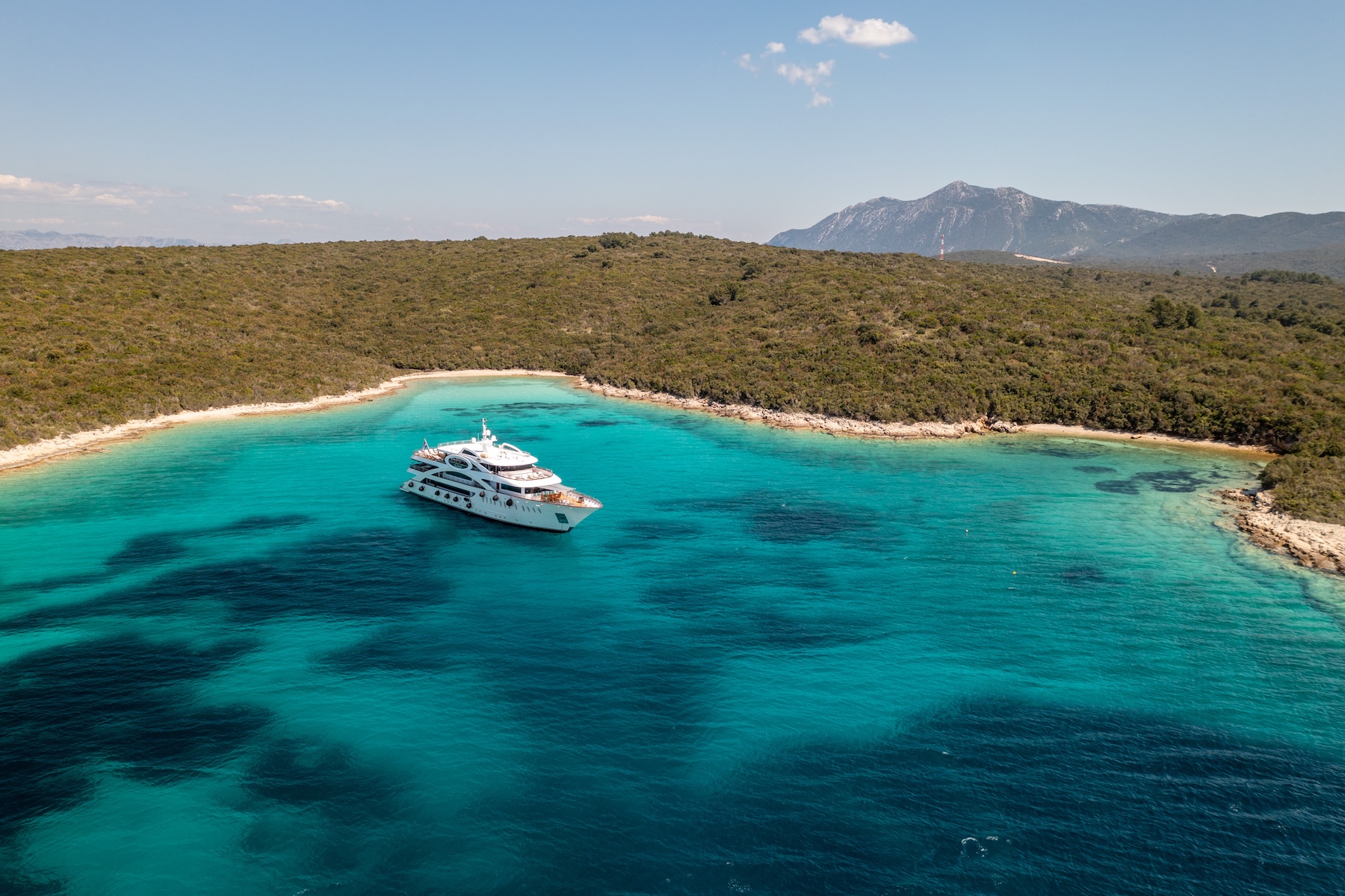 Private yacht anchored in a hidden cove along Croatia’s Dalmatian Coast