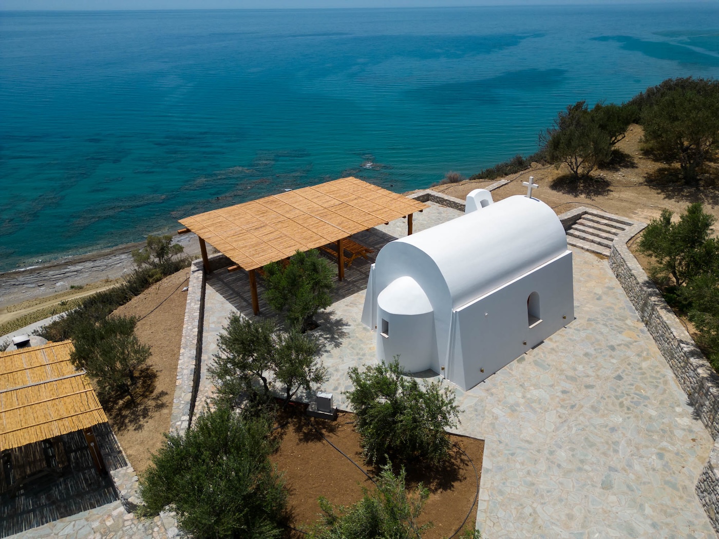 Private white chapel overlooking the Mediterranean sea on a secluded coastal estate