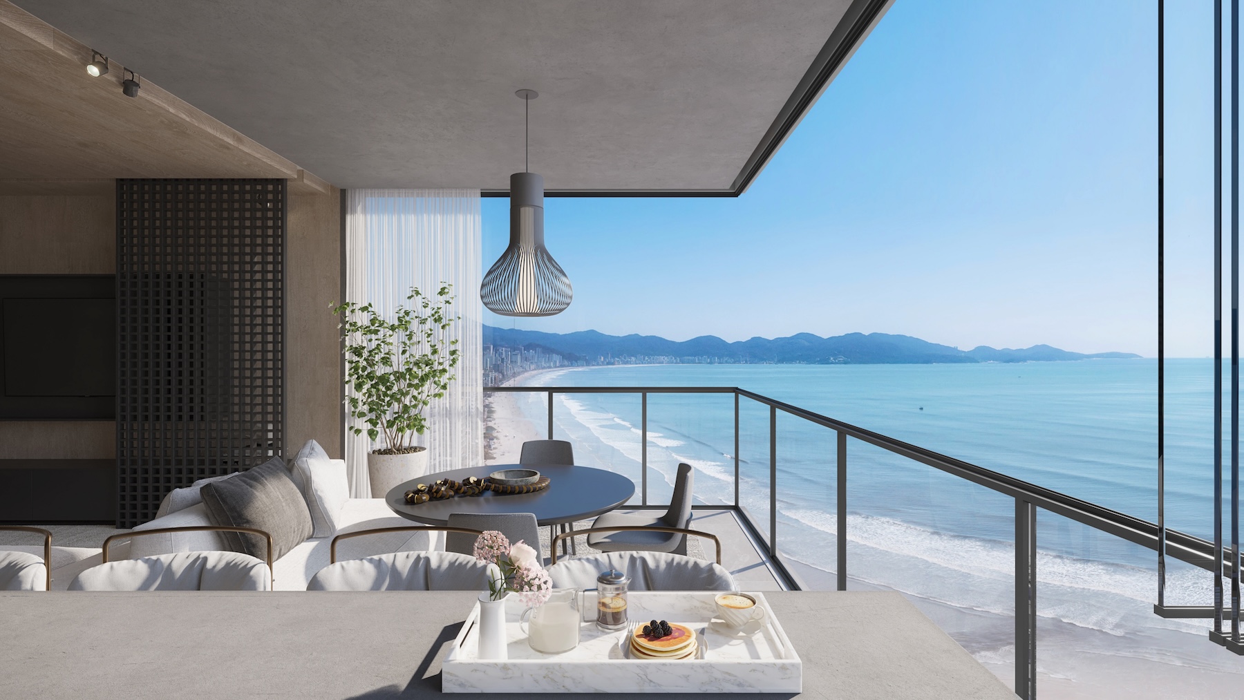 Contemporary coastal living space overlooking the ocean and shoreline