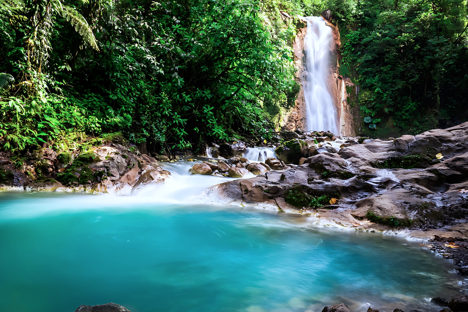 Waterfall surrounded by tropical rainforest in Costa Rica, reflecting the country's rich biodiversity.
