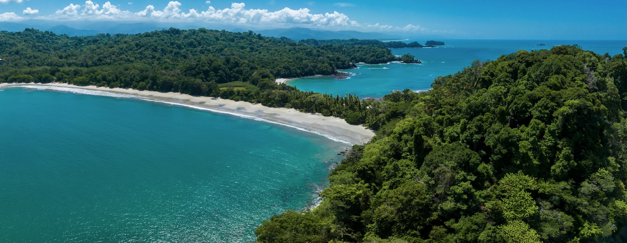 Aerial view of Manuel Antonio National Park where rainforest meets Costa Rica's Pacific coast.