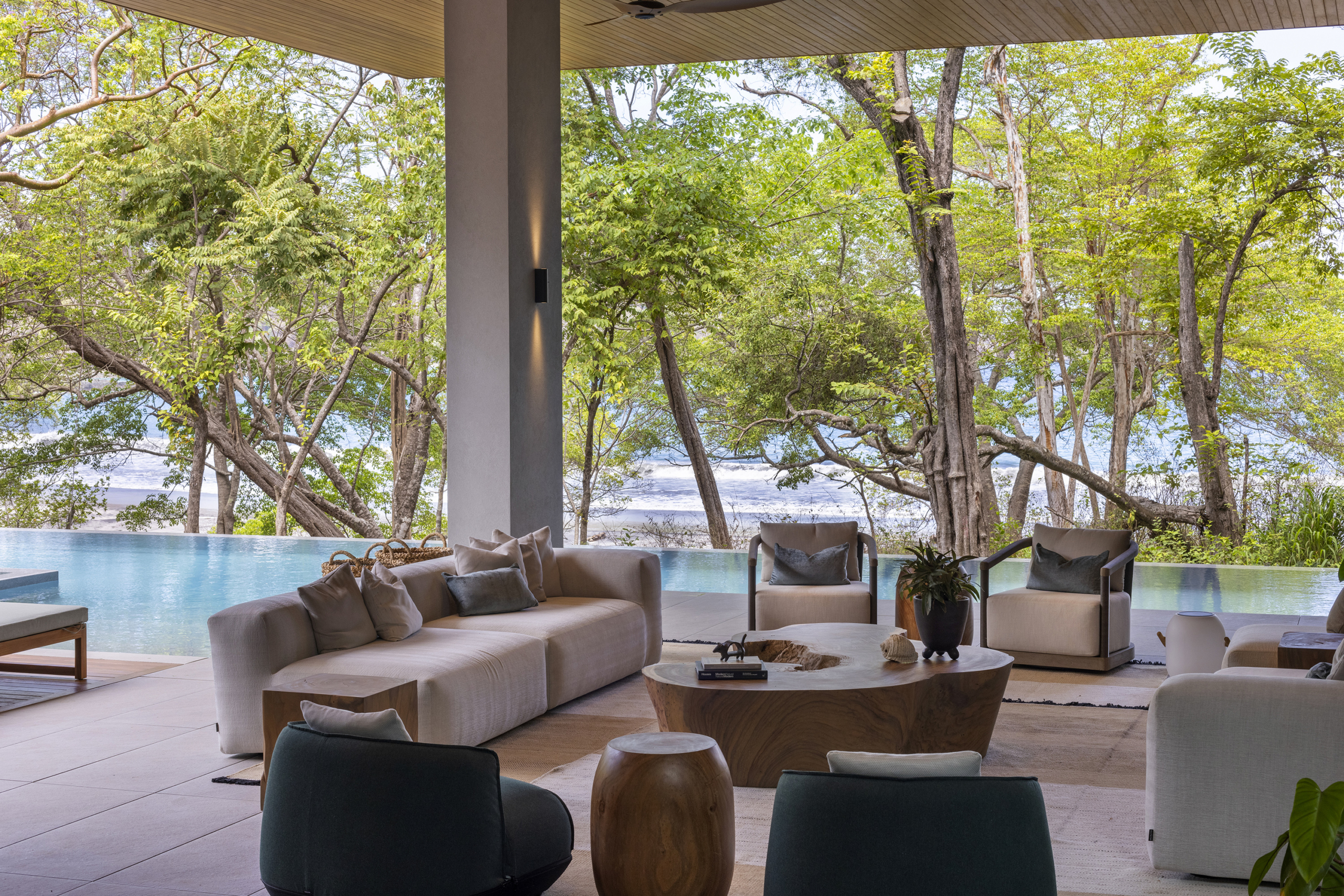 Open-air lounge at Villa Avellana overlooking the pool and Pacific