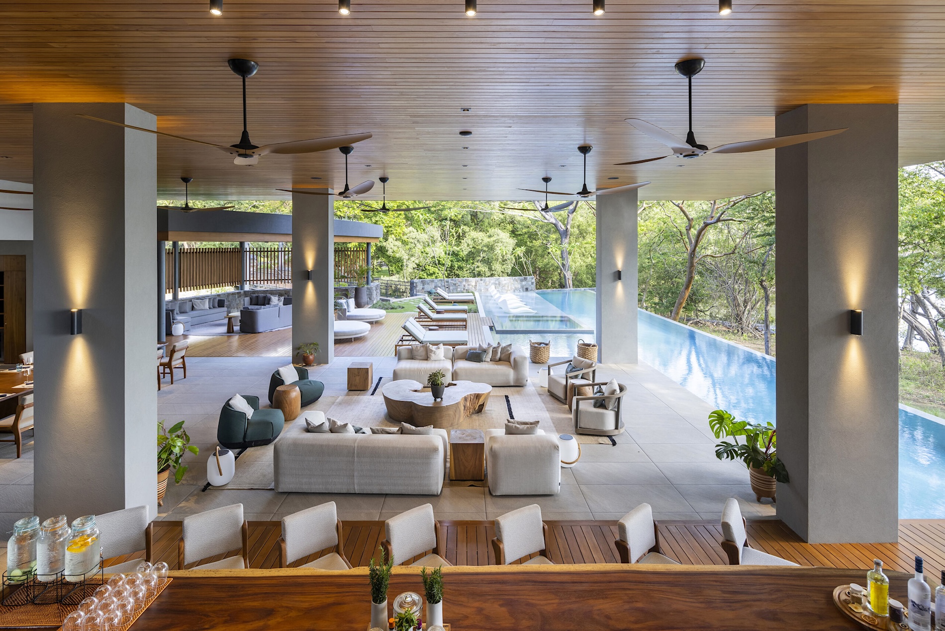 Expansive open-air terrace, lounge, bar and infinity pool at Villa Avellana in Costa Rica