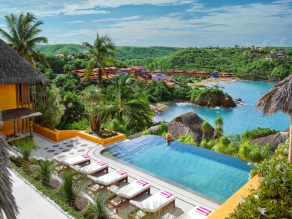 nfinity pool at Casa Torre overlooking the tropical coastline and bay of Careyes, Mexico.