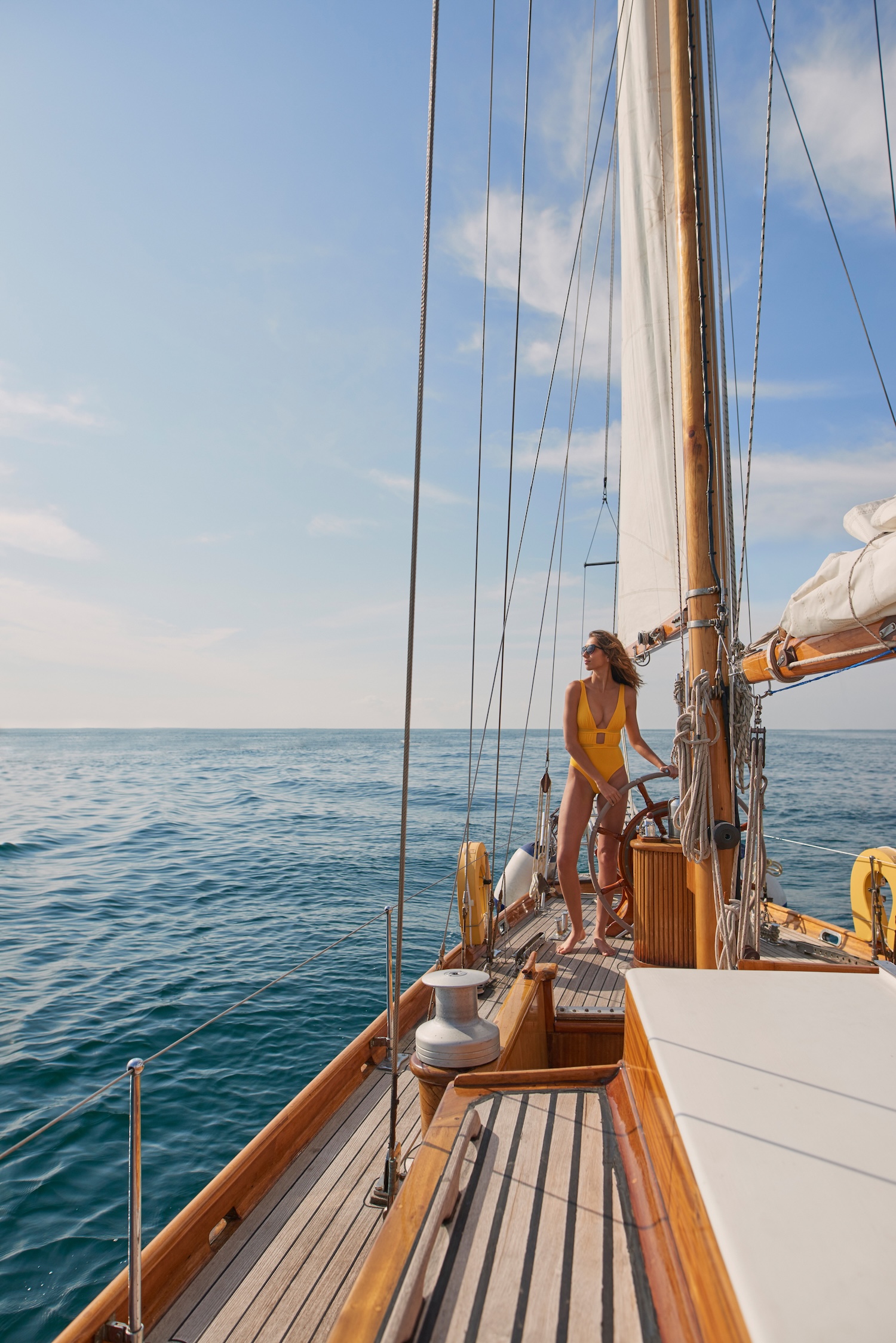 Woman sailing aboard a classic yacht off the coast of Mallorca
